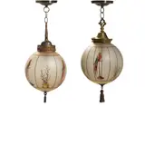 Handel, Companion Pair of Globe Hanging Lights, 6705, painted glass shades decorated with parrots and plants, patinated metal hardware, one signed 'HANDEL 6705' along upper rim