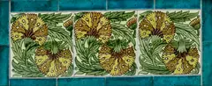 Three-Tile Floral Panel by William De Morgan, each depicting stylized flowers, polychrome-glazed earthenware, impressed 'W, sold Dec 2023