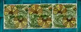 William De Morgan, Three-Tile Floral Panel, each depicting stylized flowers, polychrome-glazed earthenware, impressed 'W