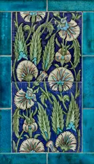 Two-Tile Floral Panel by William De Morgan, painted with Persian flowers and leaves, glazed earthenware, surrounded by border tiles, sold Dec 2023