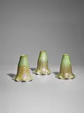 Three Lamp Shades by Quezal Art Glass and Decorating Company, iridescent glass, each engraved 'QUEZAL', sold Dec 2023