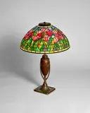 'Tulip' Table Lamp by Tiffany Studios, leaded glass, patinated bronze, shade stamped 'Tiffany Stvdios New York,' base stamped 'Tiffany Studios 444', sold Dec 2023