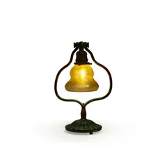 Harp Table Lamp by Tiffany Studios, patinated bronze, decorated Favrile glass, the base stamped 'TIFFANY STUDIOS NEW YORK 419' on underside, fitter rim inci, sold Jul 2023