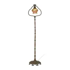 Floor Lamp by Tiffany Studios, patinated bronze, Favrile glass, the base stamped 'TIFFANY STUDIOS NEW YORK 425', sold Jul 2023
