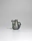 Ewer by Salviati & C., translucent blown glass gemel with applied handle with tooled decoration and two curved spouts applied with finials, offered Nov 2022