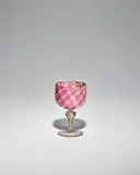 Chalice by Salviati & C., blown glass internally decorated with reticello filigree with aventurine, stem with spiral aventurine wrap, sold Nov 2022