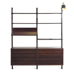 Wall Unit by Paul McCobb, mahogany and enameled metal, sold Mar 2023