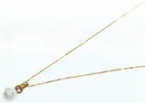 Untitled by Gold Necklace with Pearl Pendant by Hans Brumann, gold and pearl, sold Mar 2020