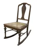 Untitled by Antique children’s rocking chair, Tanguile with bone inlay, sold Apr 2019