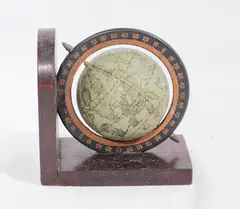 Untitled by An antique miniature globe, sold Oct 2018