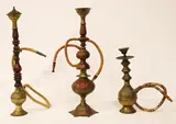 Untitled by A lot of Middle-Eastern hookah pipes, a.) 17 1/2” (44 cm) b.) 16 1/2” (42 cm) c.) 10” (25 cm), sold Oct 2018