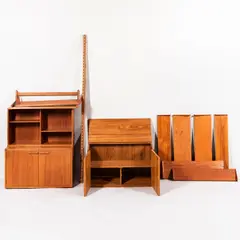 Jesper Teak Wall-mounted Shelving System, Denmark, 20th century, modules consisting of one open case with shelves, ht. 19 3/4, wd. 33 3/4, dp. 11, one case with doors, interior with single fixed shelf, ht. 20, wd. 33 3/4, dp. 17 3/4, one case with doors, interior with one adjustable shelf and two short drawers, ht. 20, wd. 33 3/4, dp. 17 3/4, one shelf 33 3/4 x 17 1/2, one shelf 33 3/4 x 11, three shelves 33 3/4 x 9 1/4, three shelves 33 3/4 x 7, three wall-mounting hardware strips, ht. 79, one ht. 63 in.