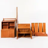 Jesper Teak Wall-mounted Shelving System, Denmark, 20th century, modules consisting of one open case with shelves, ht. 19 3/4, wd. 33 3/4, dp. 11, one case with doors, interior with single fixed shelf, ht. 20, wd. 33 3/4, dp. 17 3/4, one case with doors, interior with one adjustable shelf and two short drawers, ht. 20, wd. 33 3/4, dp. 17 3/4, one shelf 33 3/4 x 17 1/2, one shelf 33 3/4 x 11, three shelves 33 3/4 x 9 1/4, three shelves 33 3/4 x 7, three wall-mounting hardware strips, ht. 79, one ht. 63 in.