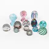 Thirteen Murano Glass Paperweights, unsigned, four with Fratelli Toso foil labels, three with Koscherak Brothers foil labels, three with "Murano Glass Made in Italy" foil labels, ht. to 5 1/2 in. (14 cm).