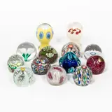 Thirteen Murano Glass Paperweights, three with Fratelli Toso foil labels, two Alfredo Barbini for Weil Ceramics & Glass foil labels, three with "Murano Glass Made in Italy" foil labels, one with Koscherak Brothers foil label, one with partial Murano label and partial label for Dayton's, ht. to 4 7/8 in. (12.5 cm).