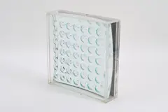 Spiegelobjekt by Adolf Luther, 1970, Glasscheibe mit Konvexlinsen auf einer Seite vor Konkavspiegel vor Holz in Plexiglaskasten, sold Jun 2022