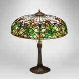 Rare Tulip table lamp shade by Suess Ornamental Glass Company, c. 1910, leaded glass, patinated metal, sold Jul 2025