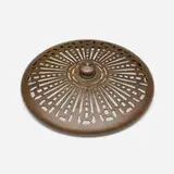Heat cap by Tiffany Studios, c. 1910, patinated bronze, sold Jul 2025
