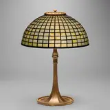 Geometric table lamp by Tiffany Studios, c. 1910, acid-etched and gilt bronze, leaded glass, sold Jul 2025