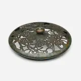 Grapevine heat cap by Tiffany Studios, c. 1910, patinated bronze, sold Jul 2025