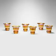 Collection of six ruffled shades by Quezal, c. 1910, hand-blown glass, sold Jul 2025