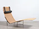 An iconic PK 24 chaise longue by Poul Kjærholm for Fritz Hansen, sold Jun 2023