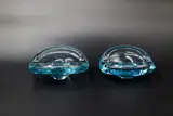 Denmark Holmegaard, Two blue tinted blown glass ash trays