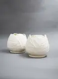 A pair of white cabbage-shaped vases by Crown Lynn Potteries, sold Feb 2023
