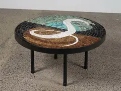 John Crichton, A large circular coffee table