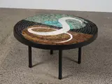 John Crichton, A large circular coffee table