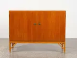 A ‘Model A-232’ two-door fitted teak cabinet by Børge Mogensen for Fdb Møbler, sold Oct 2022