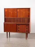 A 1960s Danish high sideboard by Denmark Johannes Andersen for J Skaaning and Søn, sold Oct 2022