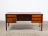 A superb freestanding rosewood ‘Model 77’ desk by Gunni Omann for Omann Jun Mobelfabrik, sold May 2021