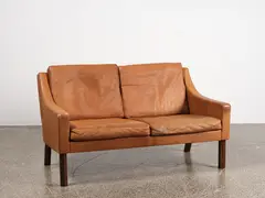 Rud Thygesen, A 1960s Danish two-seater leather sofa
