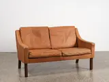 Rud Thygesen, A 1960s Danish two-seater leather sofa