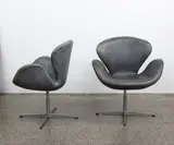 A pair of Swan chairs by Arne Jacobsen for Fritz Hansen, sold May 2021