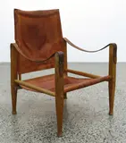 A vintage 'Sirocco' Safari chair in the style of that designed by Arne Norell (Sweden, 1917-1971) by Kaare Klint for Rud Rasmussen, sold Sep 2020