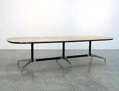 A segmented meeting table by Charles and Ray Eames, offered Sep 2020