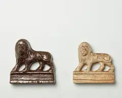 M. Exler & Son, Pair of flat backed lion mantle ornaments