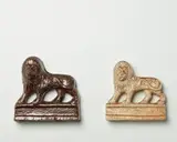M. Exler & Son, Pair of flat backed lion mantle ornaments