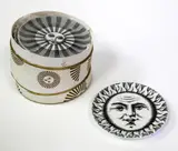 A boxed set of eight lithographic transfer design coasters by Piero Fornasetti, sold Dec 2015