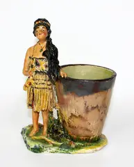 S.M. Smith, Painted pottery figure of a Maori girl and cup