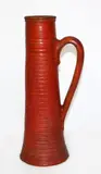 Tall orange glazed ribbed pottery jug by Jova Rancich, sold Sep 2015