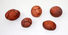 Five stoneware pebbles by Len Castle, offered Sep 2015