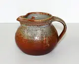 Shino glaze stoneware jug by Len Castle, sold Sep 2015
