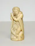 Indian carved ivory figure, of a flute player
