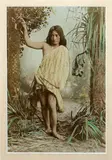 Arthur James Iles, Full length portrait of a young Maori girl in studio ‘bush setting’