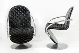 A good pair of Model 1-2-3 deluxe black leather and aluminium framed armchairs by Verner Panton for Fritz Hansen, offered Oct 2014