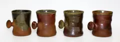 Four stoneware mugs by Barry Brickell, sold Oct 2014