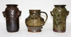 Yvonne Rust, Stoneware jug with a grotesque mask face
